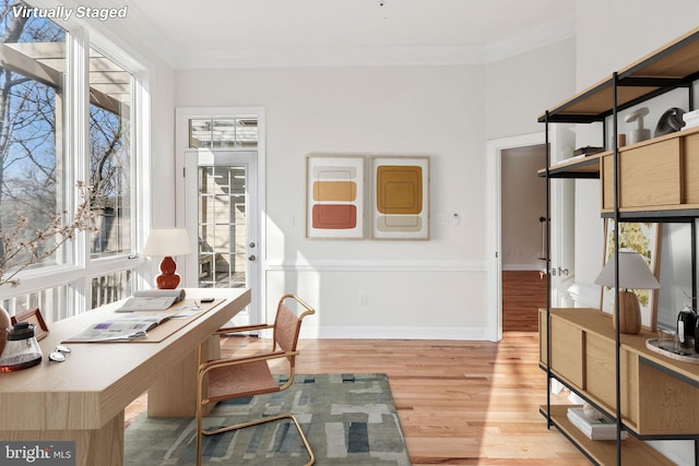 office area featuring light hardwood / wood-style flooring and ornamental molding