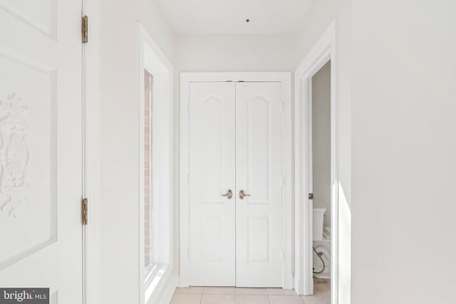 hallway featuring light tile patterned floors