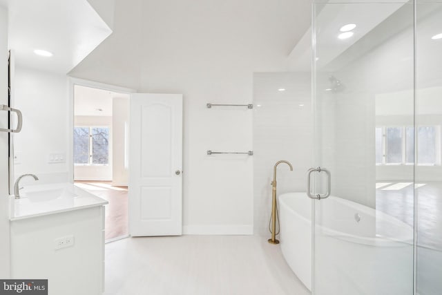 bathroom with vanity and a bathing tub