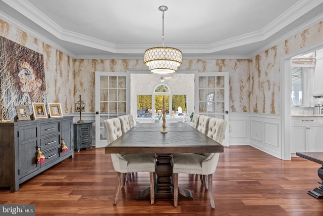 unfurnished dining area with ornamental molding and dark hardwood / wood-style flooring