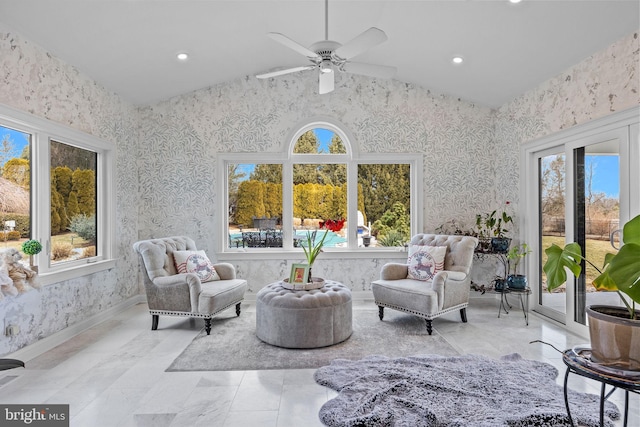 sitting room featuring ceiling fan, lofted ceiling, and plenty of natural light