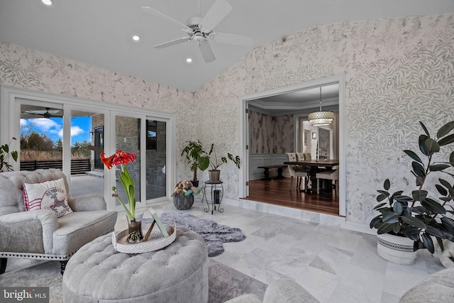 living room with ceiling fan, vaulted ceiling, crown molding, and french doors