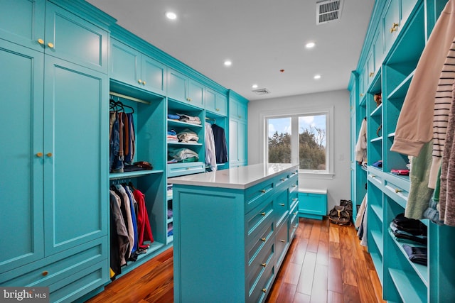 walk in closet featuring dark hardwood / wood-style flooring