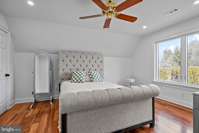 bedroom featuring ceiling fan, lofted ceiling, and dark wood-type flooring