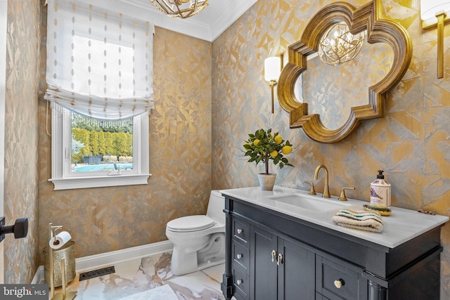 bathroom featuring vanity, crown molding, and toilet