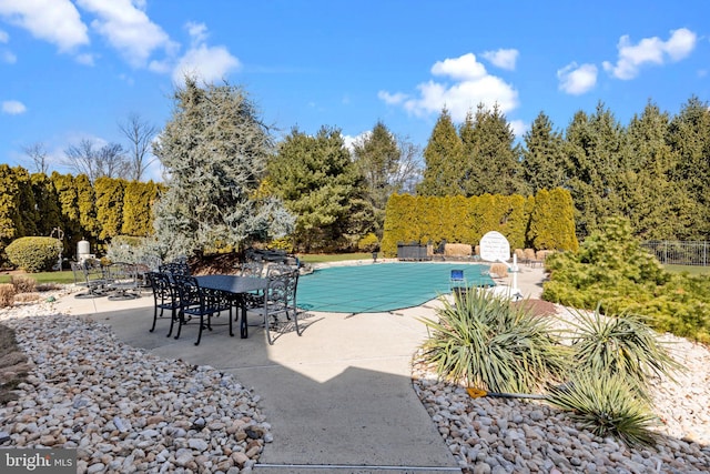 view of swimming pool featuring a patio area