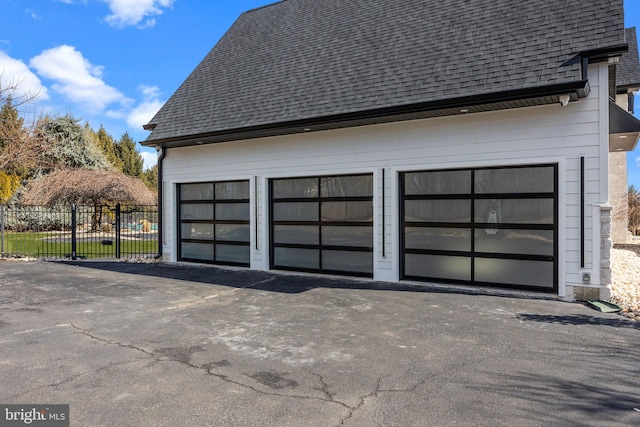 exterior space featuring a garage and an outdoor structure