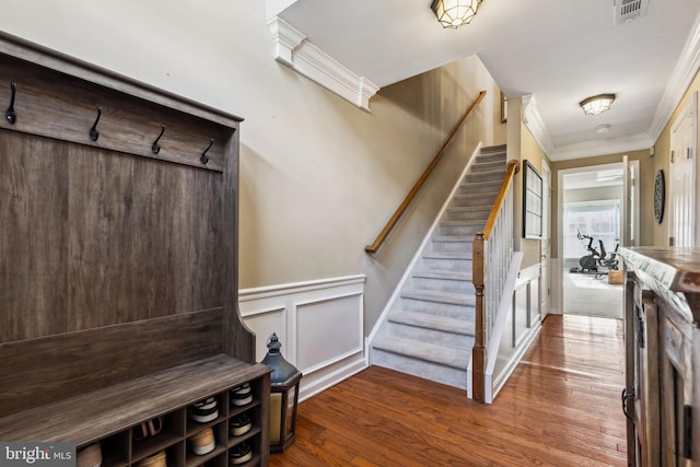 mudroom with hardwood / wood-style flooring and ornamental molding