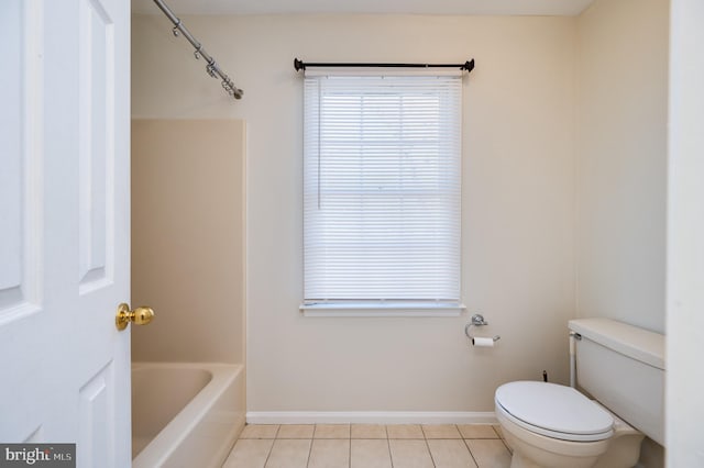 bathroom with tile patterned floors and toilet