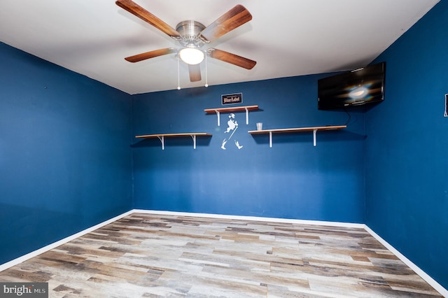 unfurnished room featuring light hardwood / wood-style floors and ceiling fan