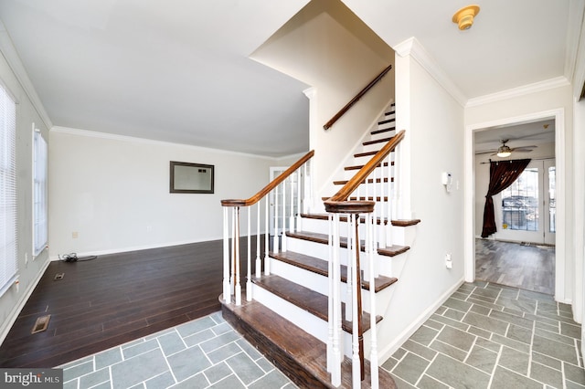 stairway with wood-type flooring and ornamental molding