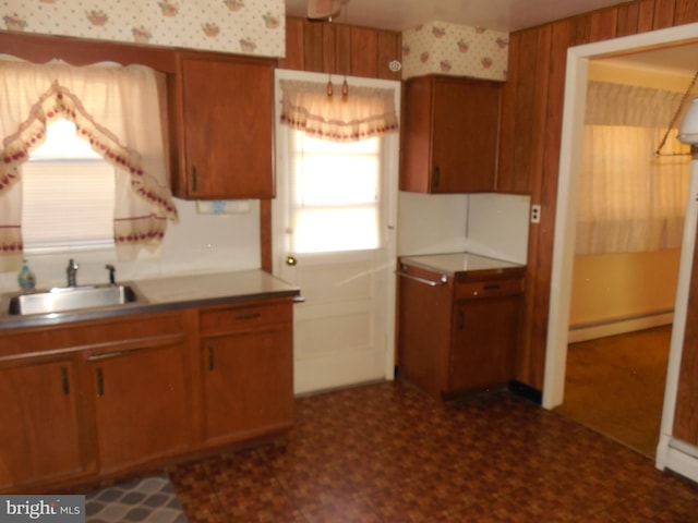 kitchen featuring sink and a baseboard heating unit