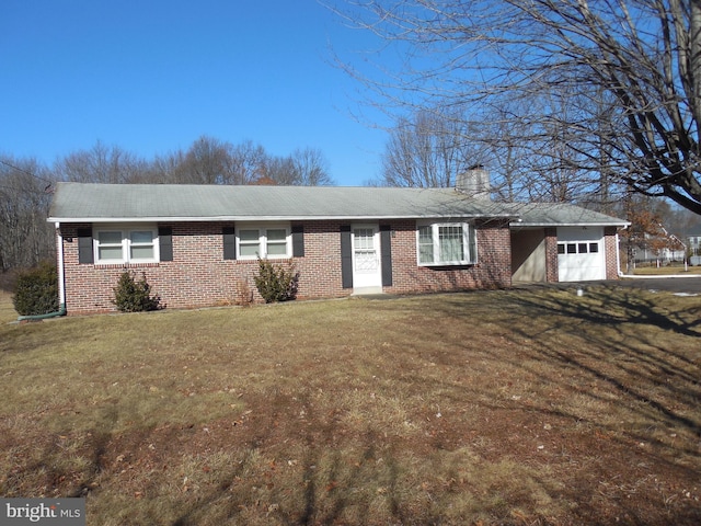 single story home featuring a garage and a front lawn