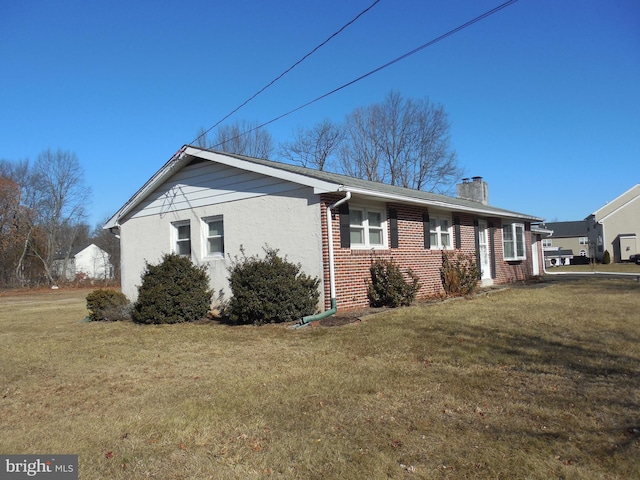 view of property exterior featuring a yard