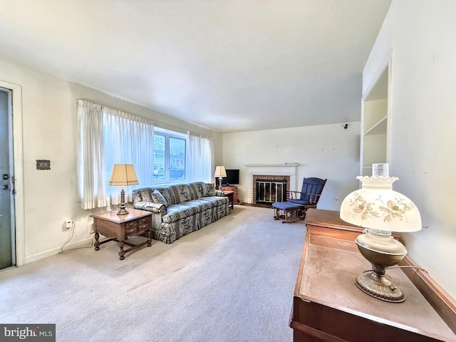 living room with carpet flooring and a brick fireplace