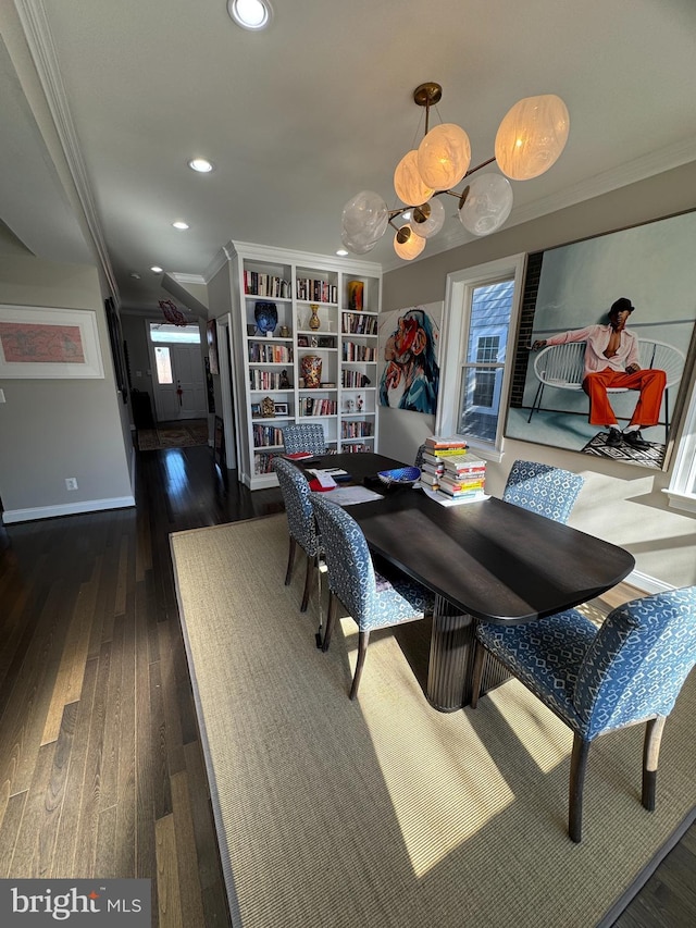 dining room featuring crown molding and dark hardwood / wood-style floors