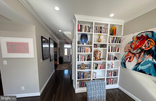 corridor with ornamental molding and dark hardwood / wood-style floors