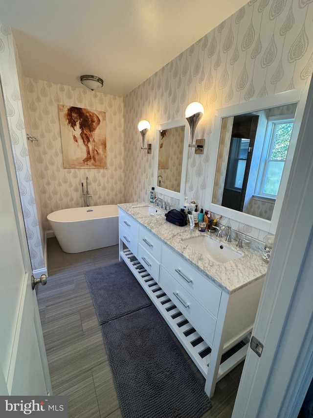 bathroom featuring vanity and a bathtub