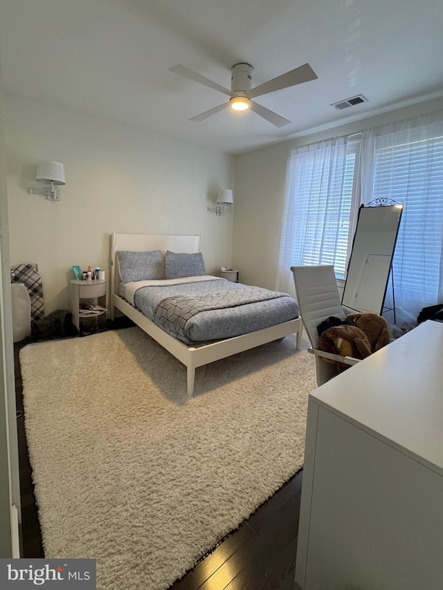 bedroom with ceiling fan and hardwood / wood-style floors