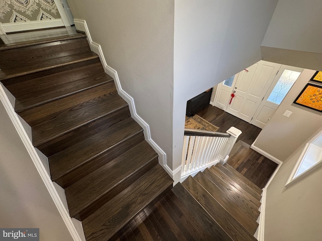 stairway featuring hardwood / wood-style flooring