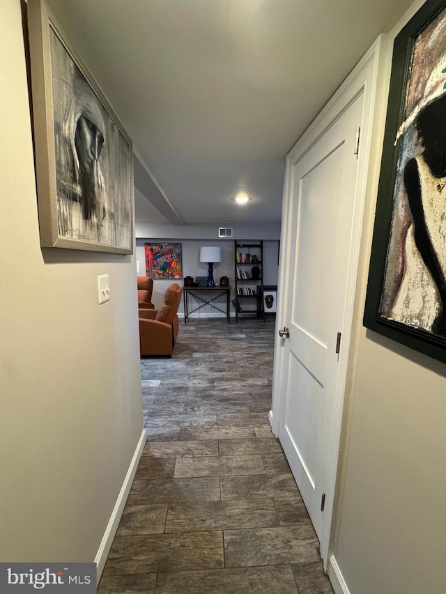 corridor featuring dark wood-type flooring