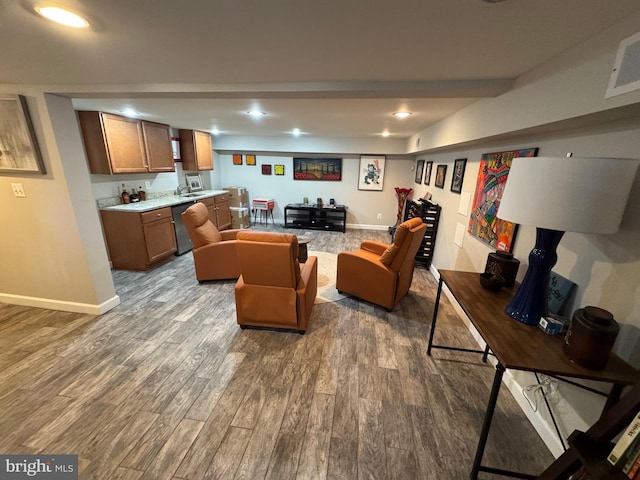 living room featuring dark wood-type flooring and sink