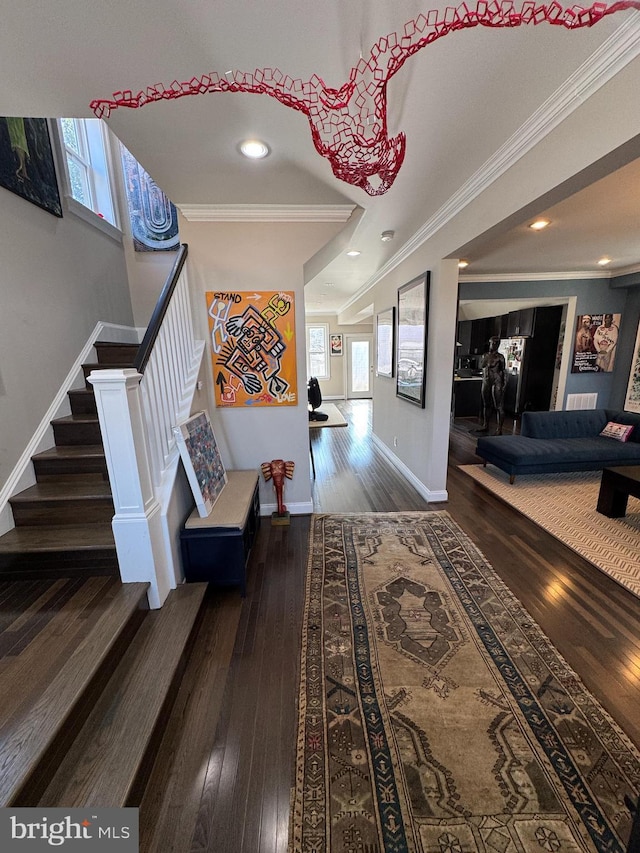 hall featuring ornamental molding, plenty of natural light, and dark hardwood / wood-style floors