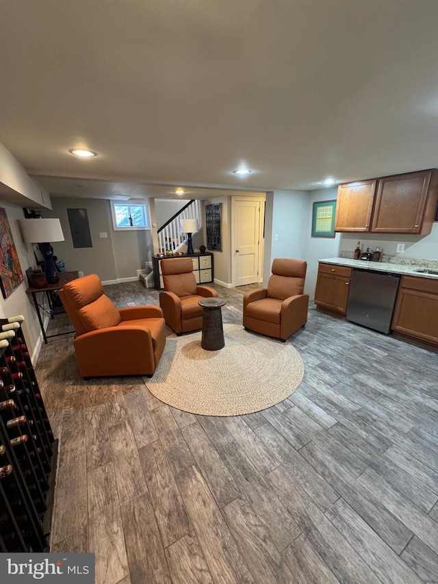 living room with sink and hardwood / wood-style floors