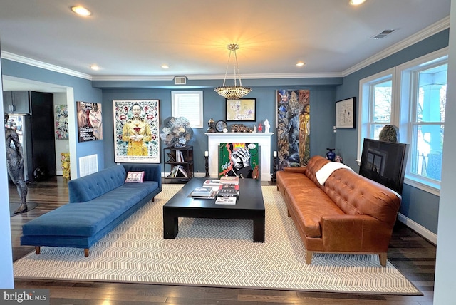 living room featuring ornamental molding and hardwood / wood-style floors