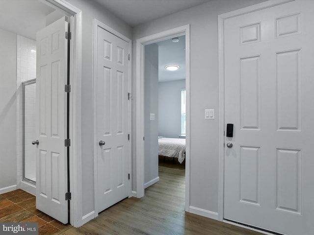 hall featuring dark wood-type flooring