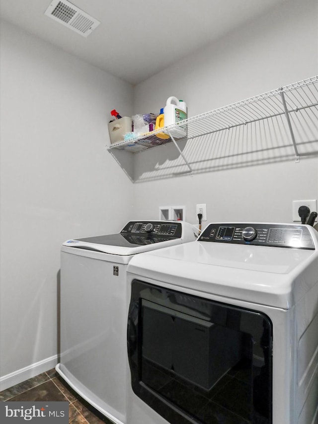 washroom featuring washing machine and dryer