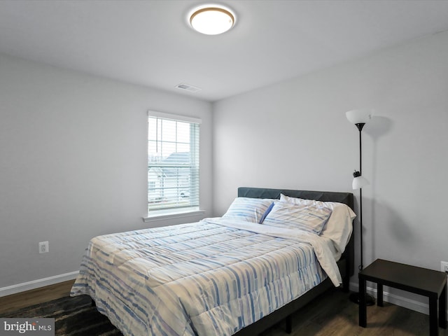 bedroom featuring dark wood-type flooring