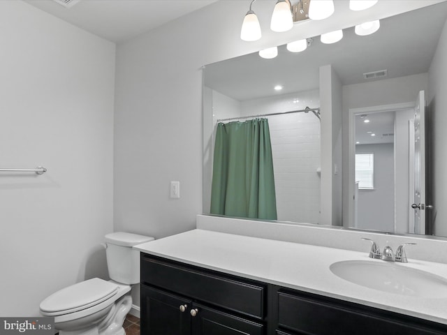 bathroom featuring vanity, tile patterned flooring, curtained shower, and toilet