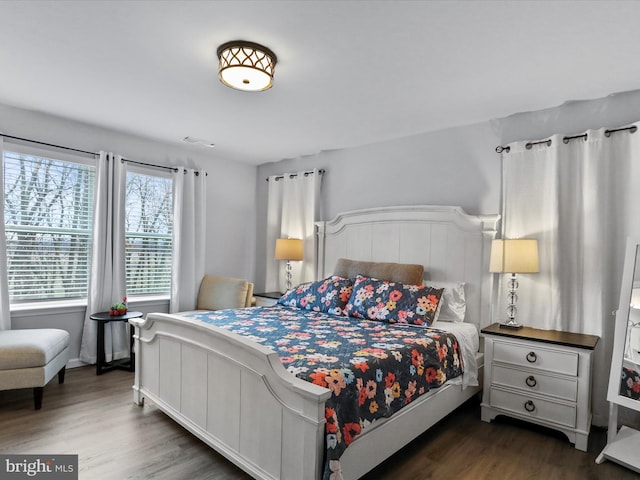 bedroom featuring dark hardwood / wood-style flooring