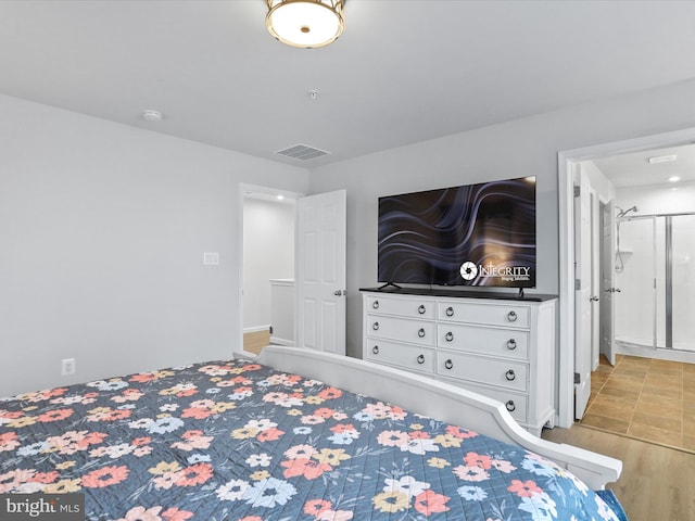 bedroom with light wood-type flooring