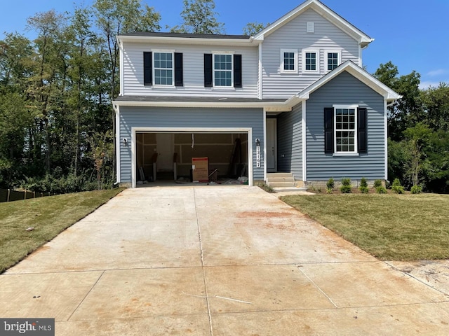 view of front of home with a garage and a front yard