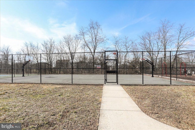 view of basketball court featuring a lawn