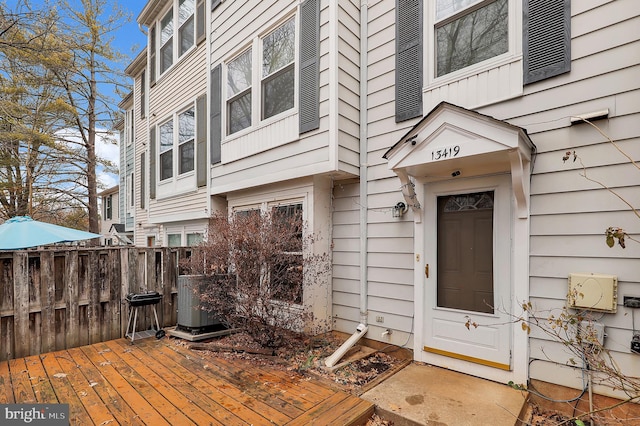 view of exterior entry featuring a deck