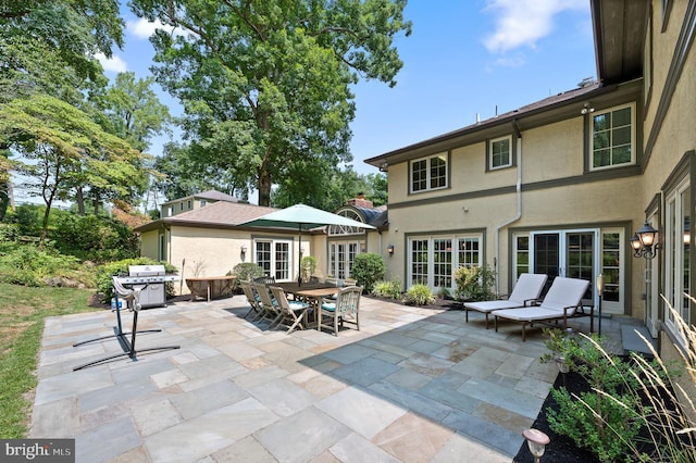 view of patio featuring french doors