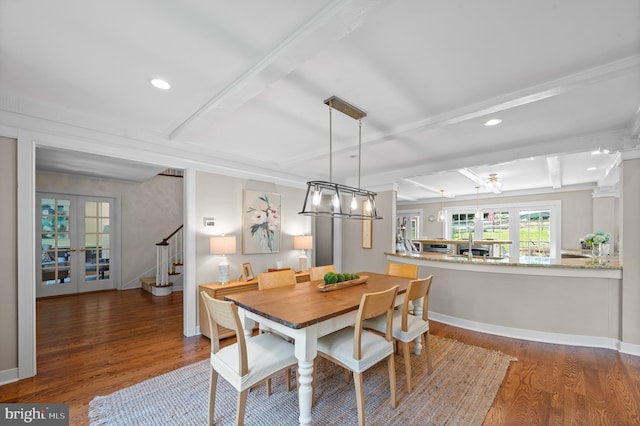 dining space featuring beamed ceiling, dark wood-type flooring, and french doors