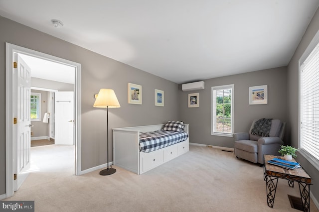 carpeted bedroom with a wall mounted AC