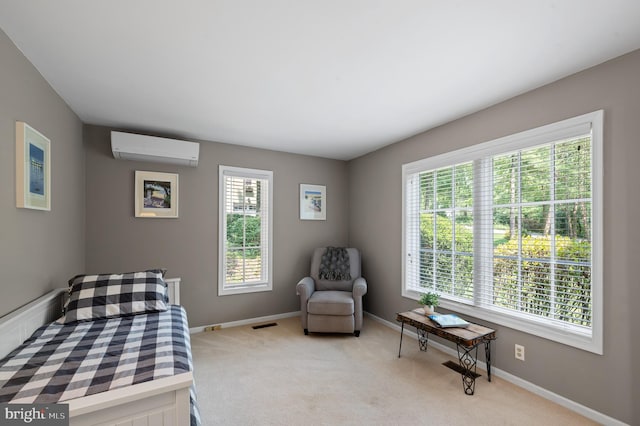 carpeted bedroom featuring a wall mounted AC