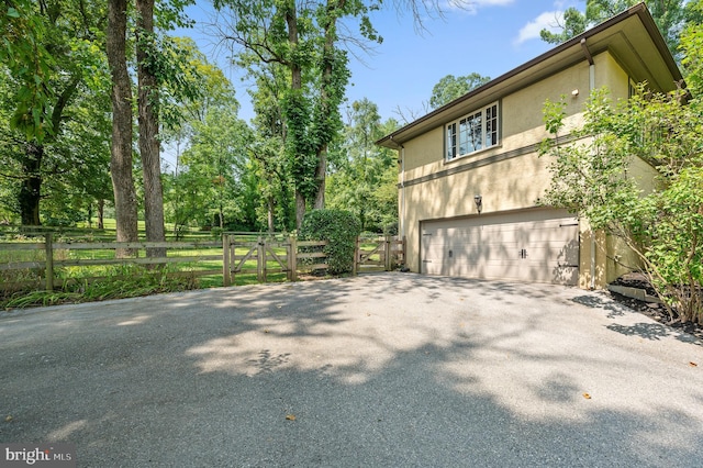 view of property exterior with a garage