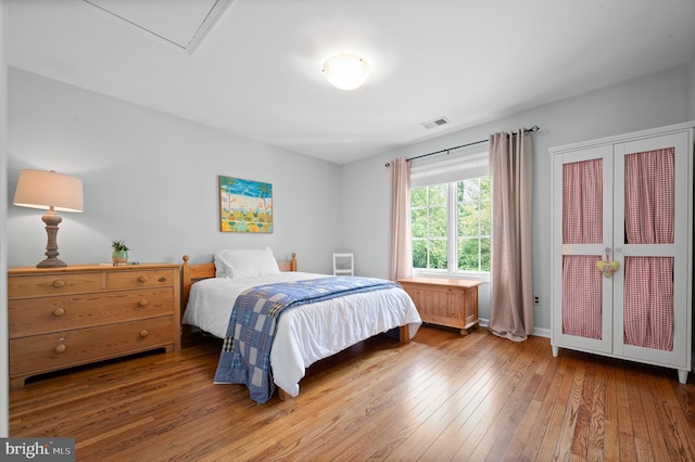 bedroom featuring hardwood / wood-style floors