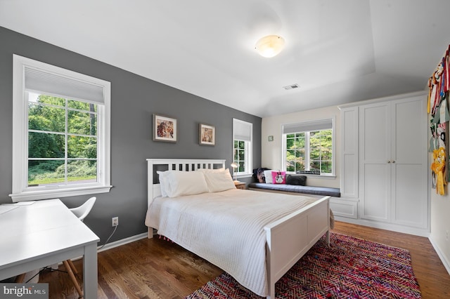 bedroom featuring dark hardwood / wood-style flooring