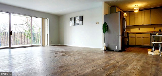 6011 Emerson St Unit 307, Bladensburg, MD 20710 - unfurnished living room with wood-type flooring