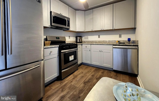 6011 Emerson St Unit 307, Bladensburg, MD 20710 - kitchen featuring light stone countertops, appliances with stainless steel finishes, and white cabinets