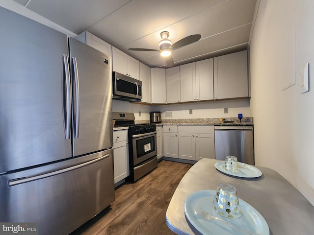 6011 Emerson St Unit 307, Bladensburg, MD 20710 - kitchen featuring ceiling fan, dark wood-type flooring, white cabinets, and appliances with stainless steel finishes