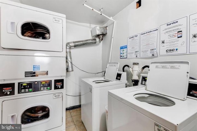 6011 Emerson St Unit 307, Bladensburg, MD 20710 - laundry area with stacked washer / dryer, washer and dryer, and light tile patterned floors