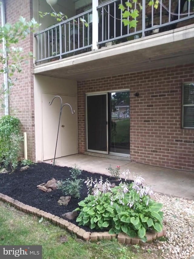 entrance to property with a patio